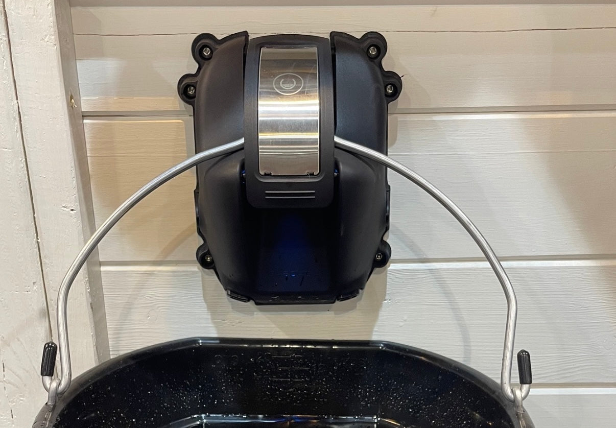 Automatic waterer installation with all plumbing and electrical hidden inside of the wall